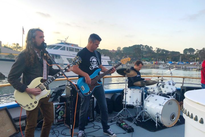 a group of people standing on a boat