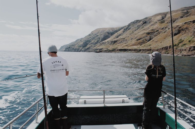 Anglers fishing from the Lex Sea near an island