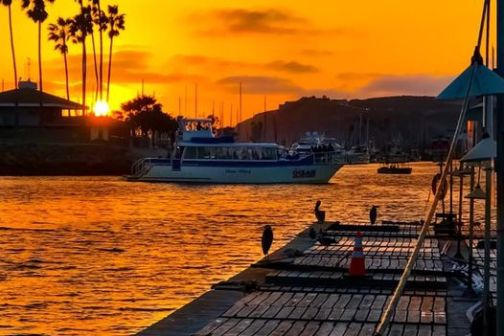 a sunset over a body of water
