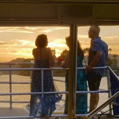 a group of people standing in front of a window