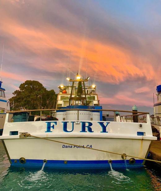 The Fury docked at Dana Wharf at sunset