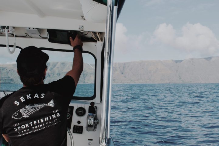 a man in a boat on a body of water