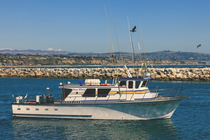 a small boat in a large body of water