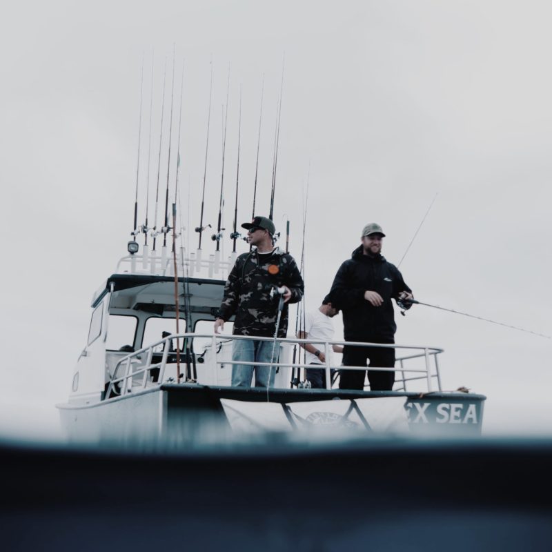 a man riding on the back of a boat