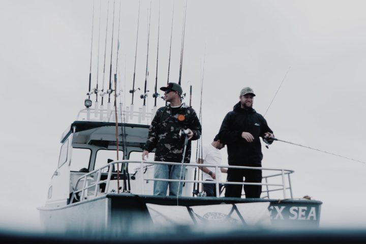 a man riding on the back of a boat