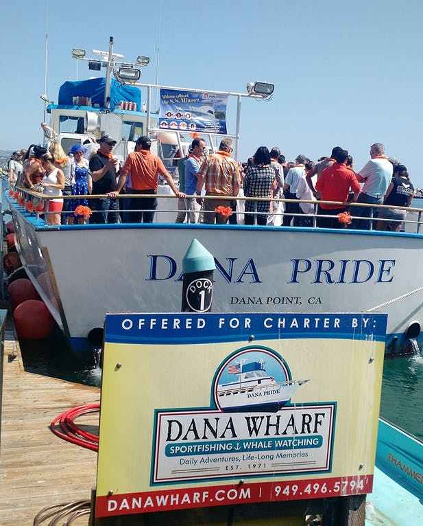 Guests boarding the Dana Pride for a private charter at Dana Wharf