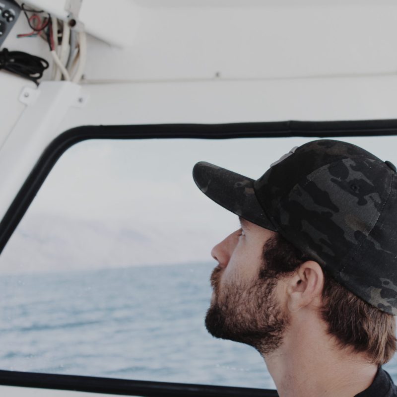a man driving a boat in the water