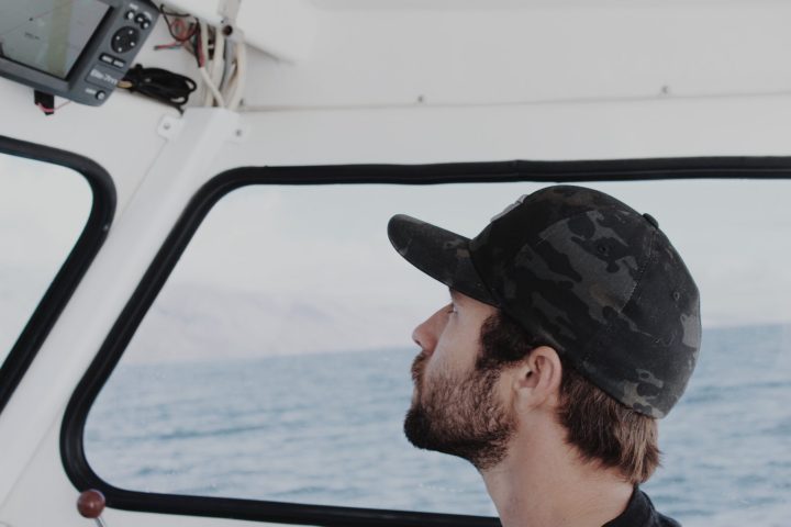 a man driving a boat in the water