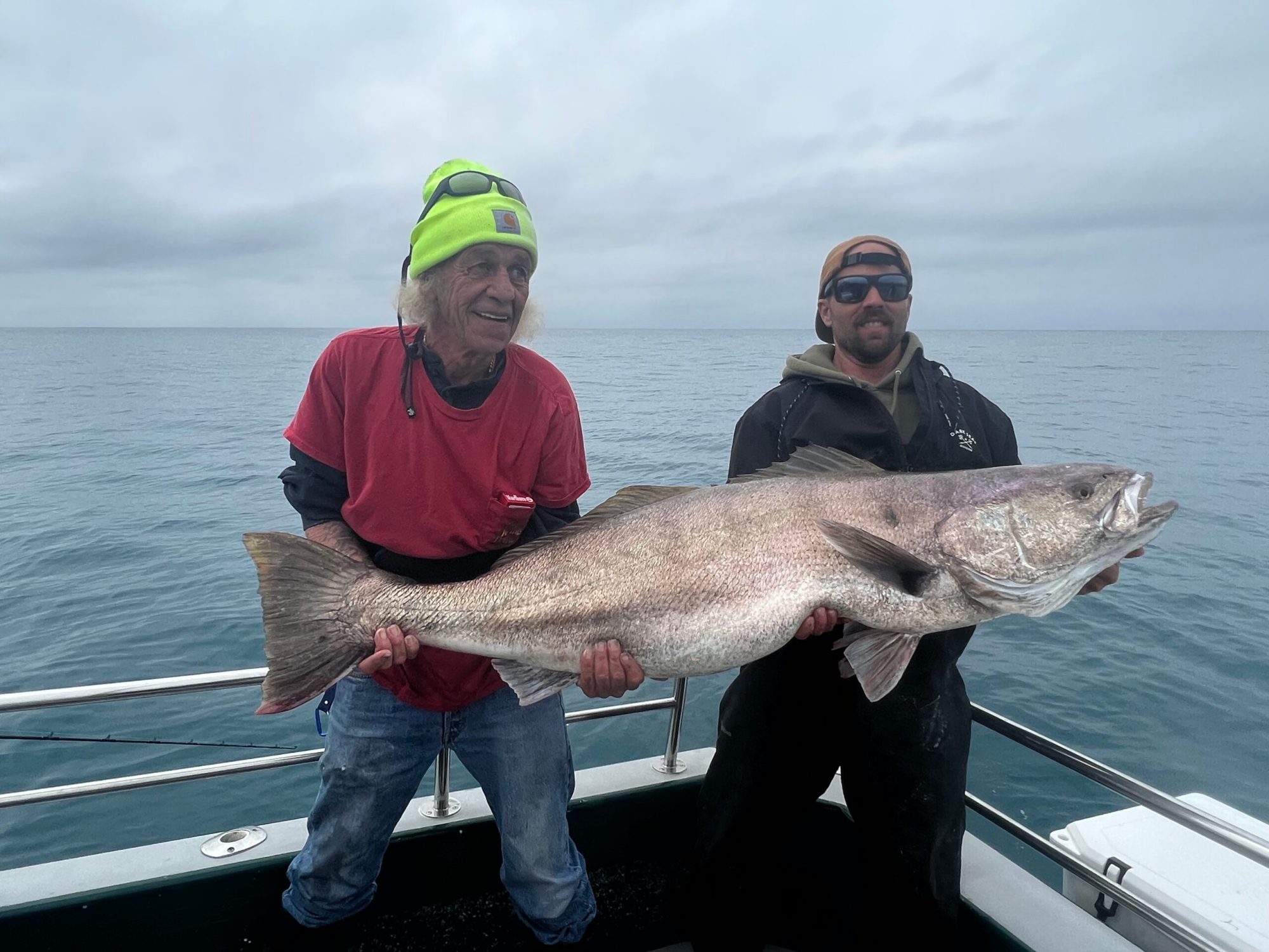 IMG-0695 a person holding a fish in the water