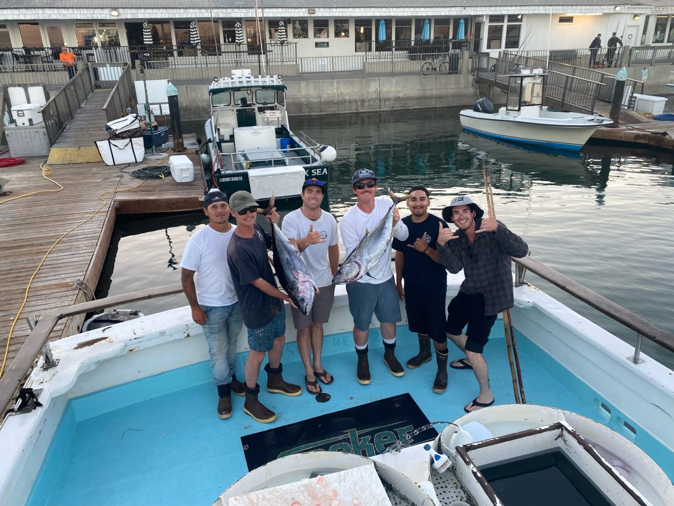 a group of people on a boat in the water