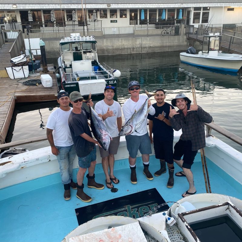 a group of people on a boat in the water