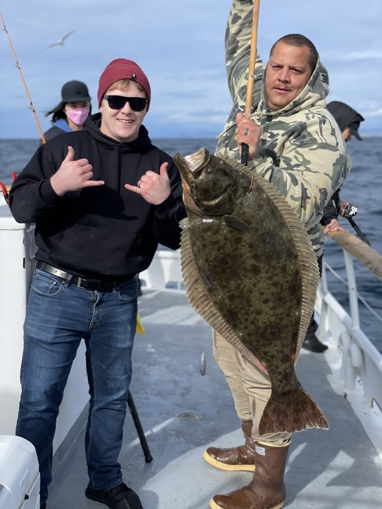 a person holding a fish