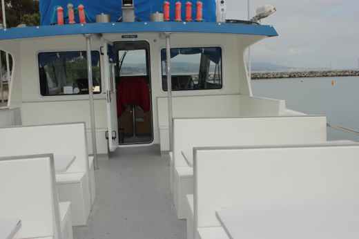Covered deck seating aboard the Dana Pride