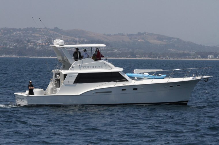 The Current cruising off Dana Point with guests on the flybridge