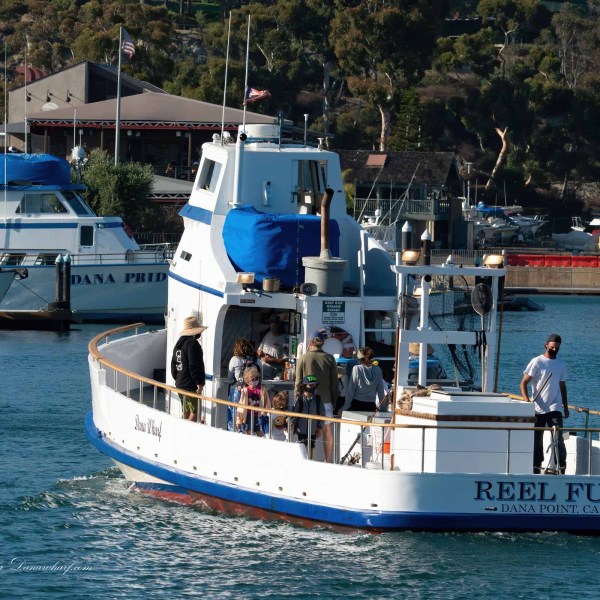 a small boat in a large body of water