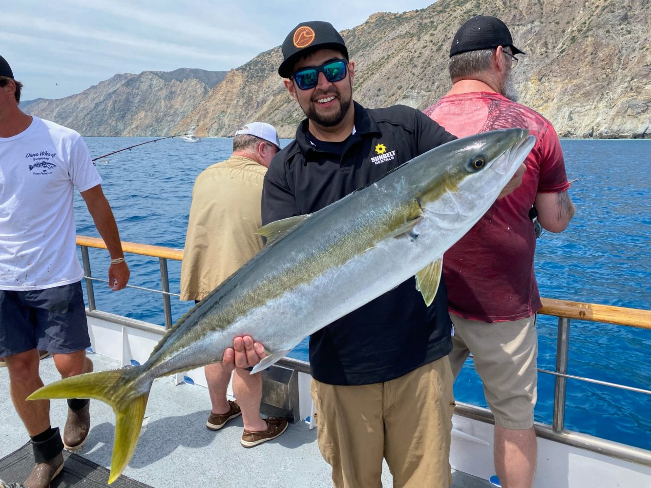 a man holding a fish