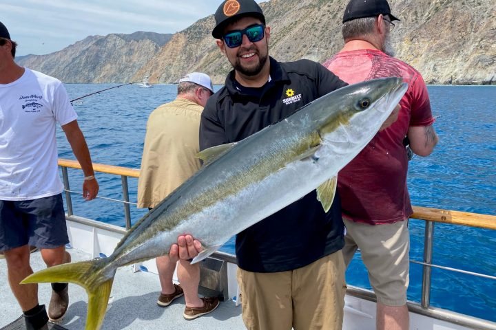 a man holding a fish