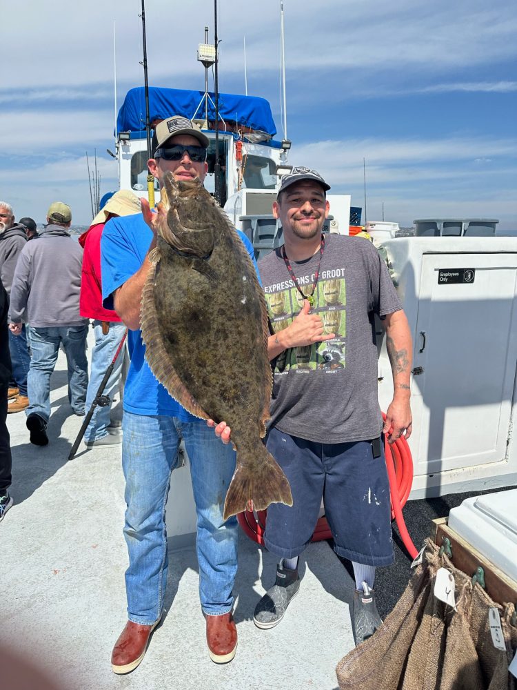 a man holding a fish