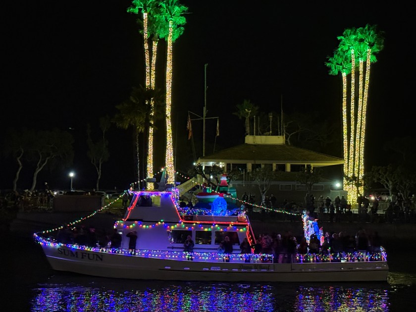 The Sum Fun decorated with holiday lights in the Dana Point Harbor Boat Parade of Lights