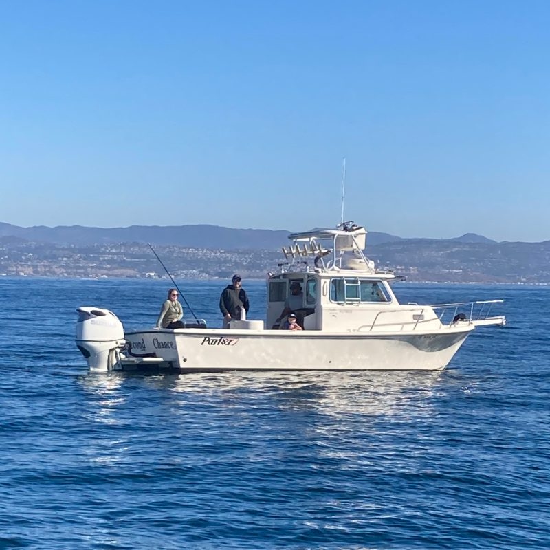 a small boat in a large body of water