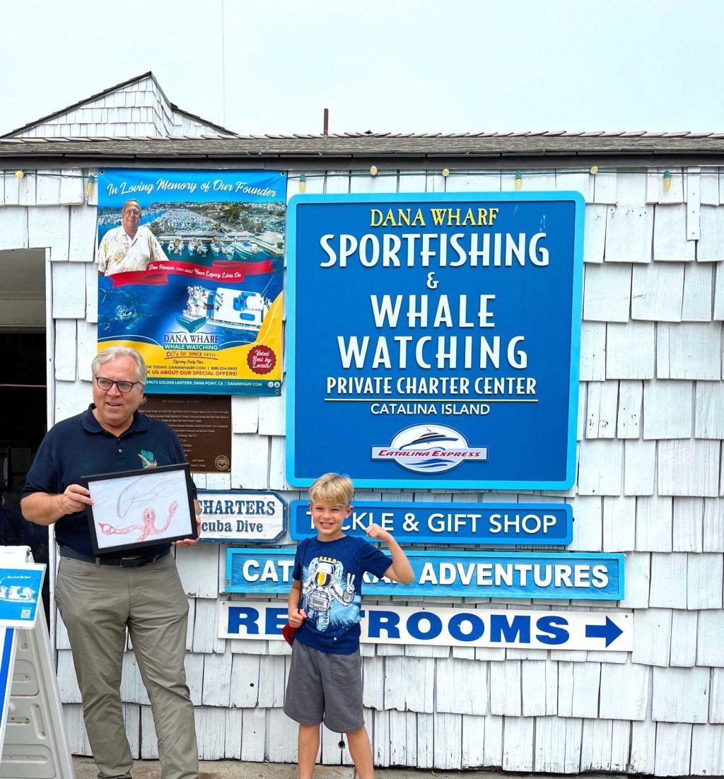a group of people standing in front of a sign
