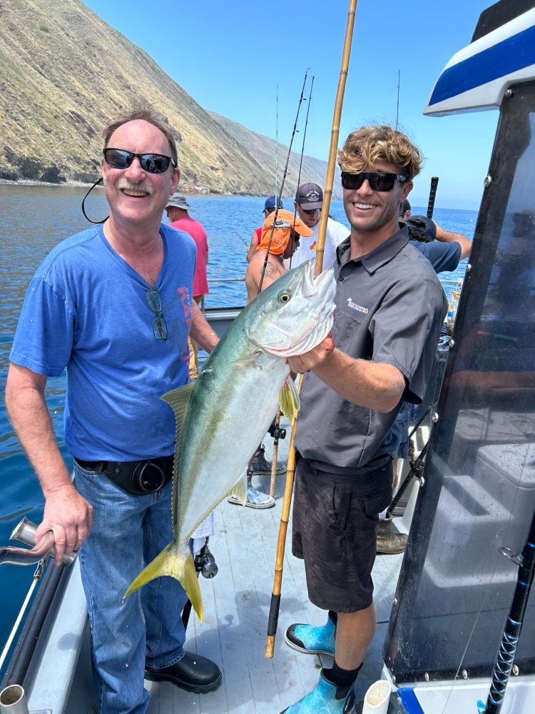 a man holding a fish