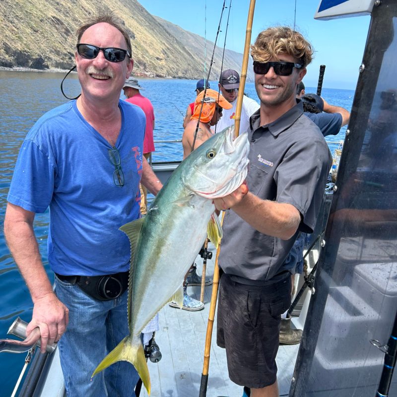 a man holding a fish