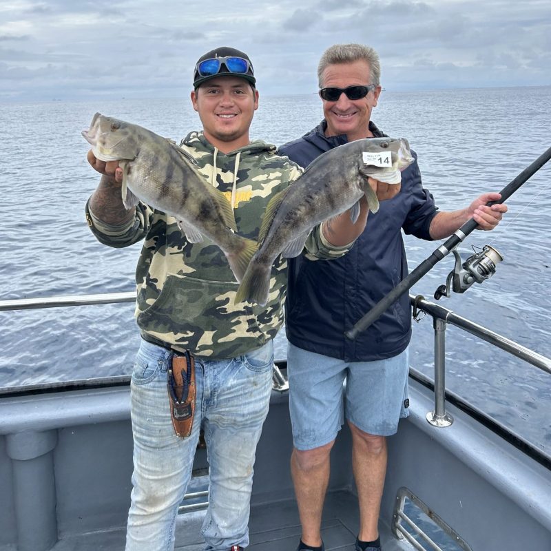 a man standing on a boat in the water
