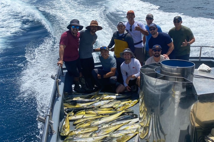a group of people on a boat in the water