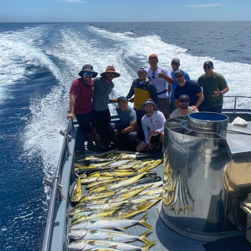 a group of people on a boat in the water