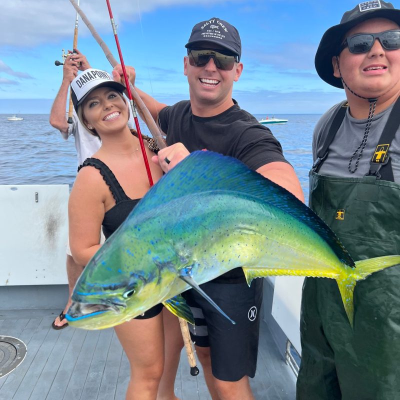 a person holding a fish in the water