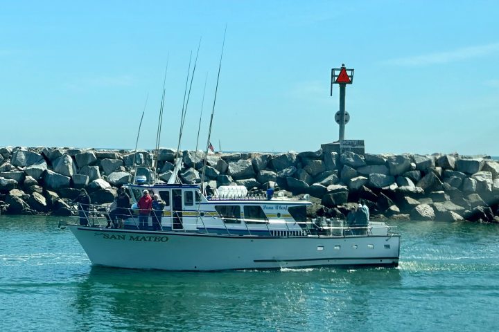 a group of people on a boat in the water