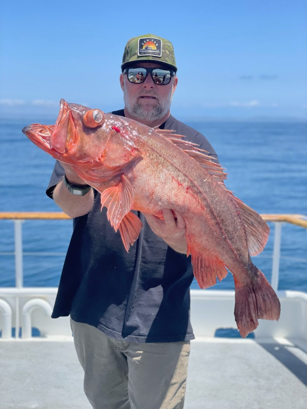 a person holding a fish in the water