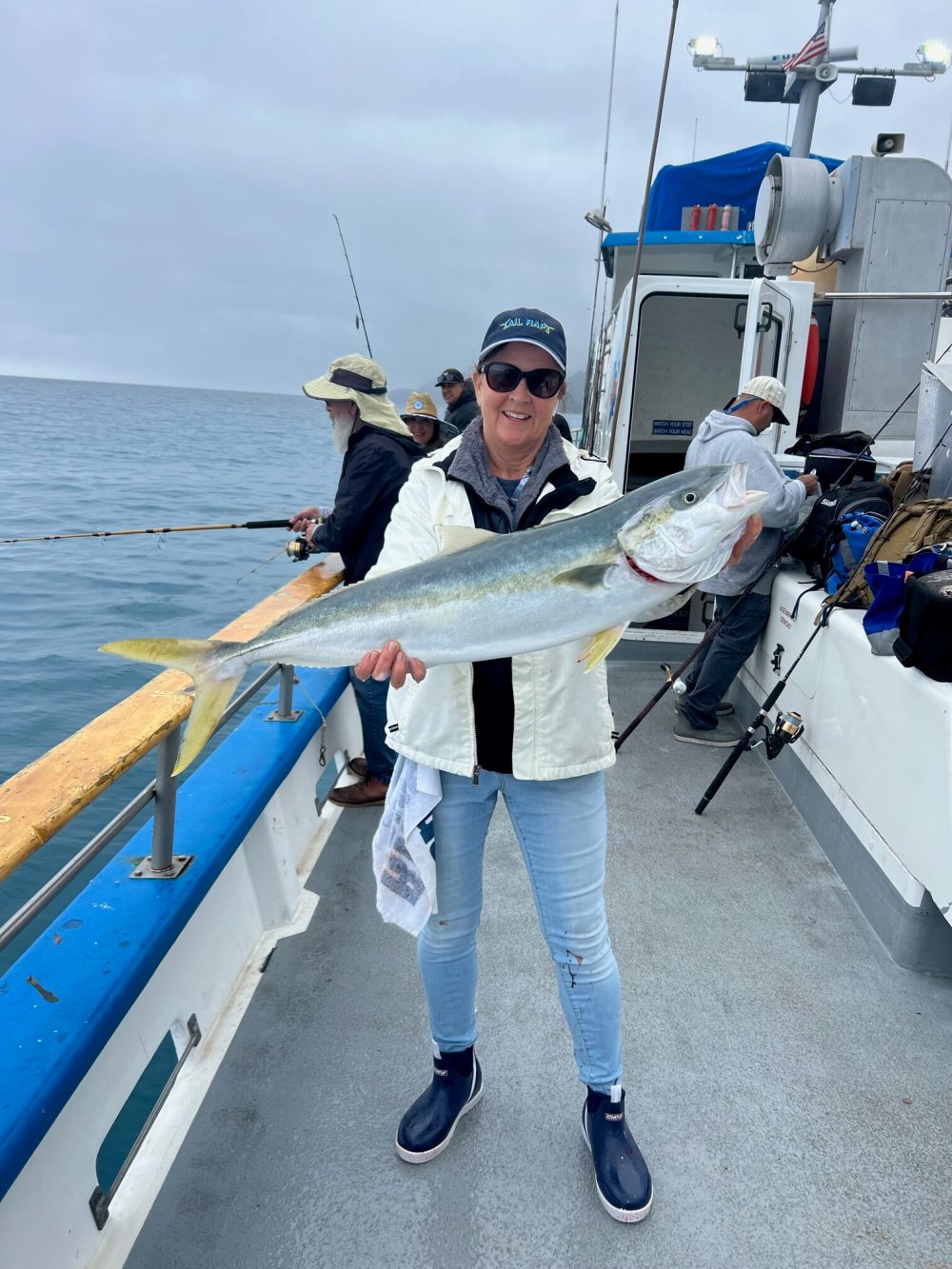 a person standing next to a body of water
