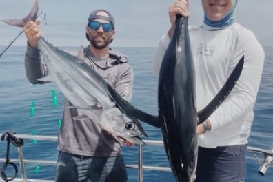 a person holding a fish