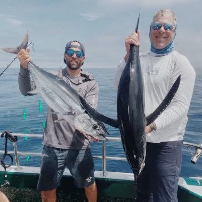 a person holding a fish