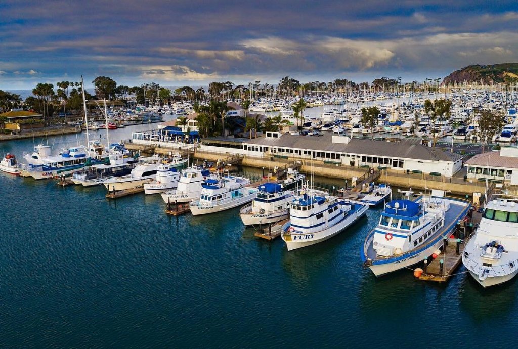 a boat is docked next to a body of water
