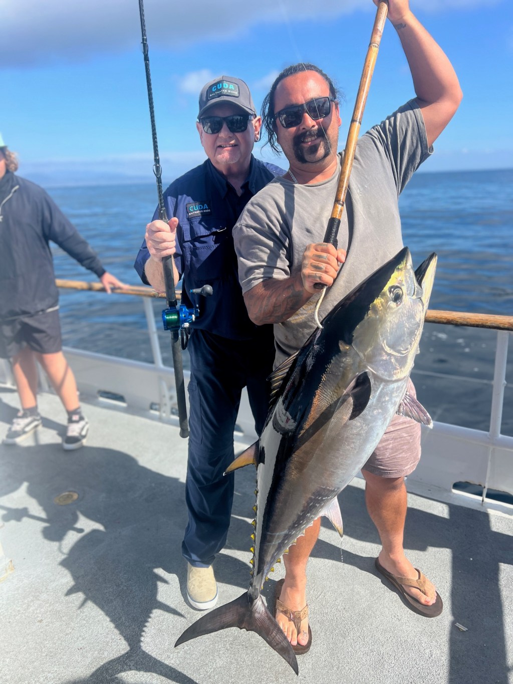 a man holding a fish in the water