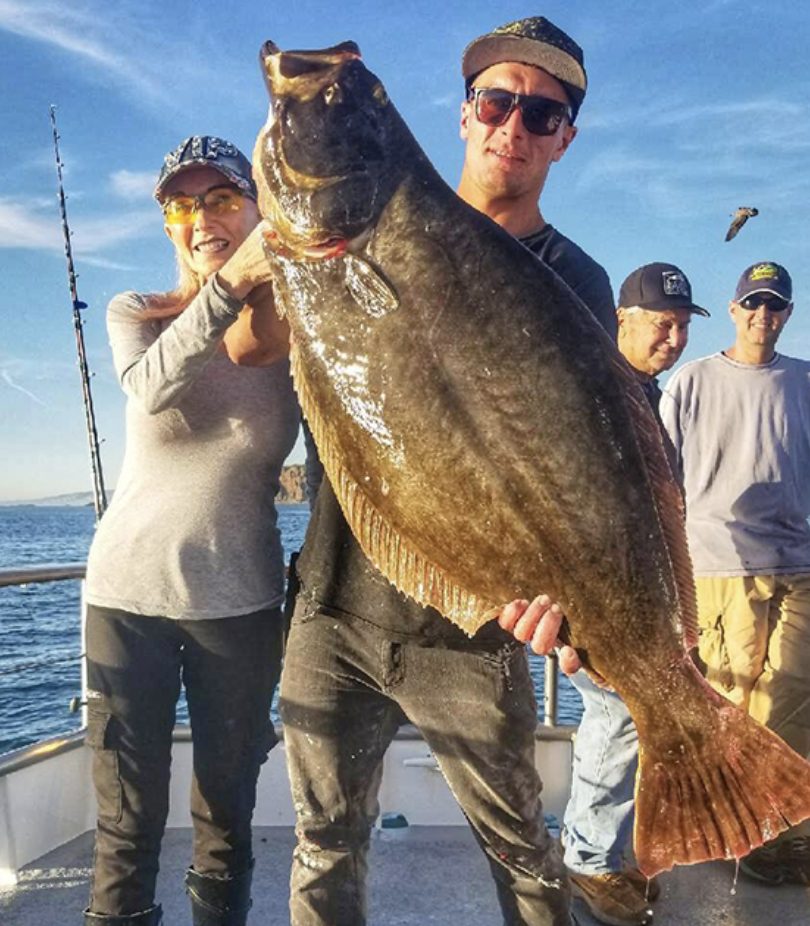 a person holding a fish