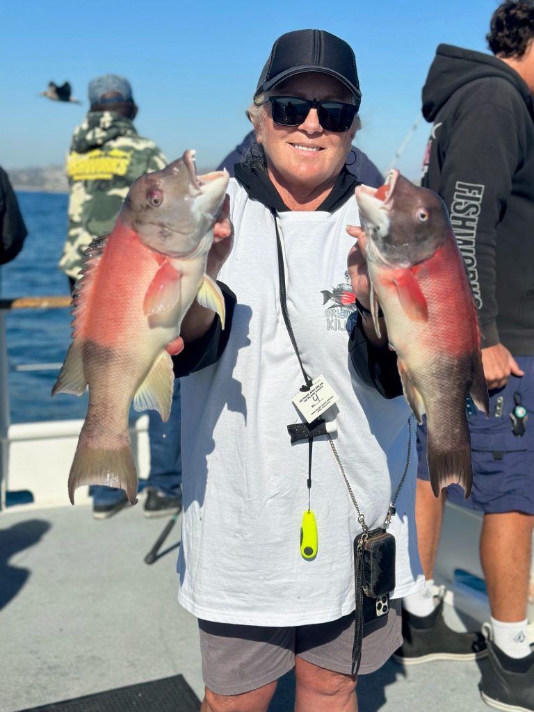 a person holding a fish