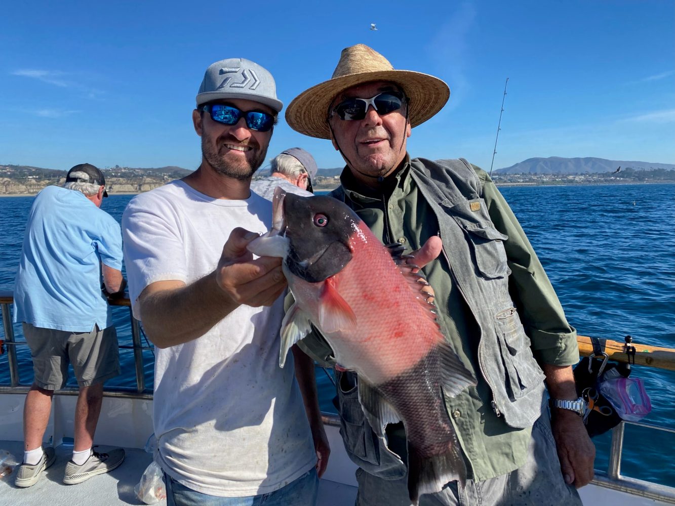 a man holding a fish