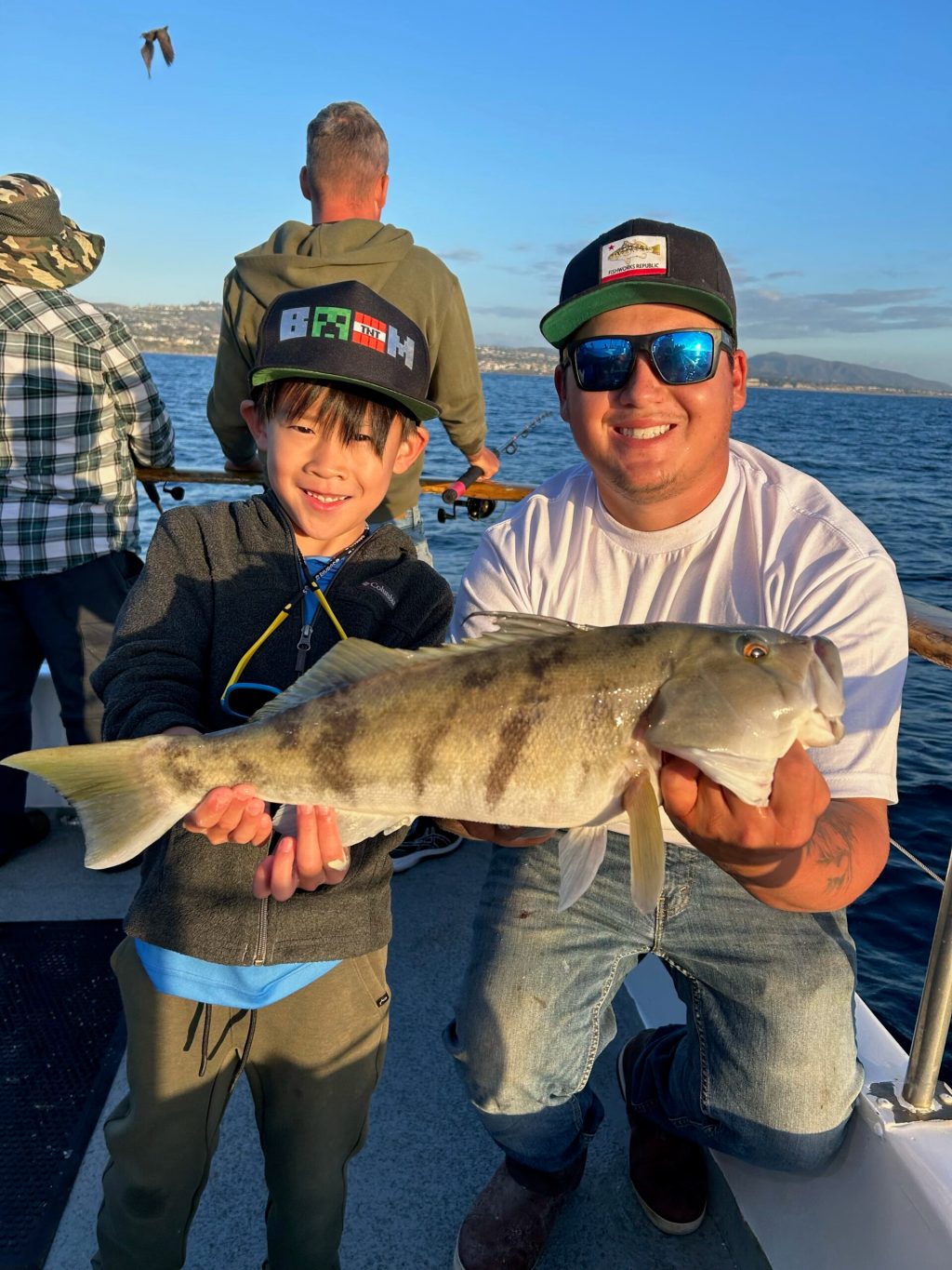 a man holding a fish