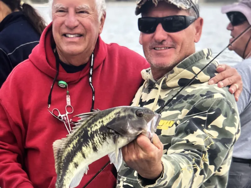 a person holding a fish