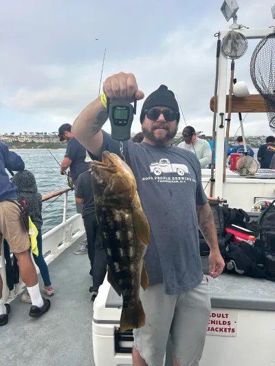 a man holding a fish