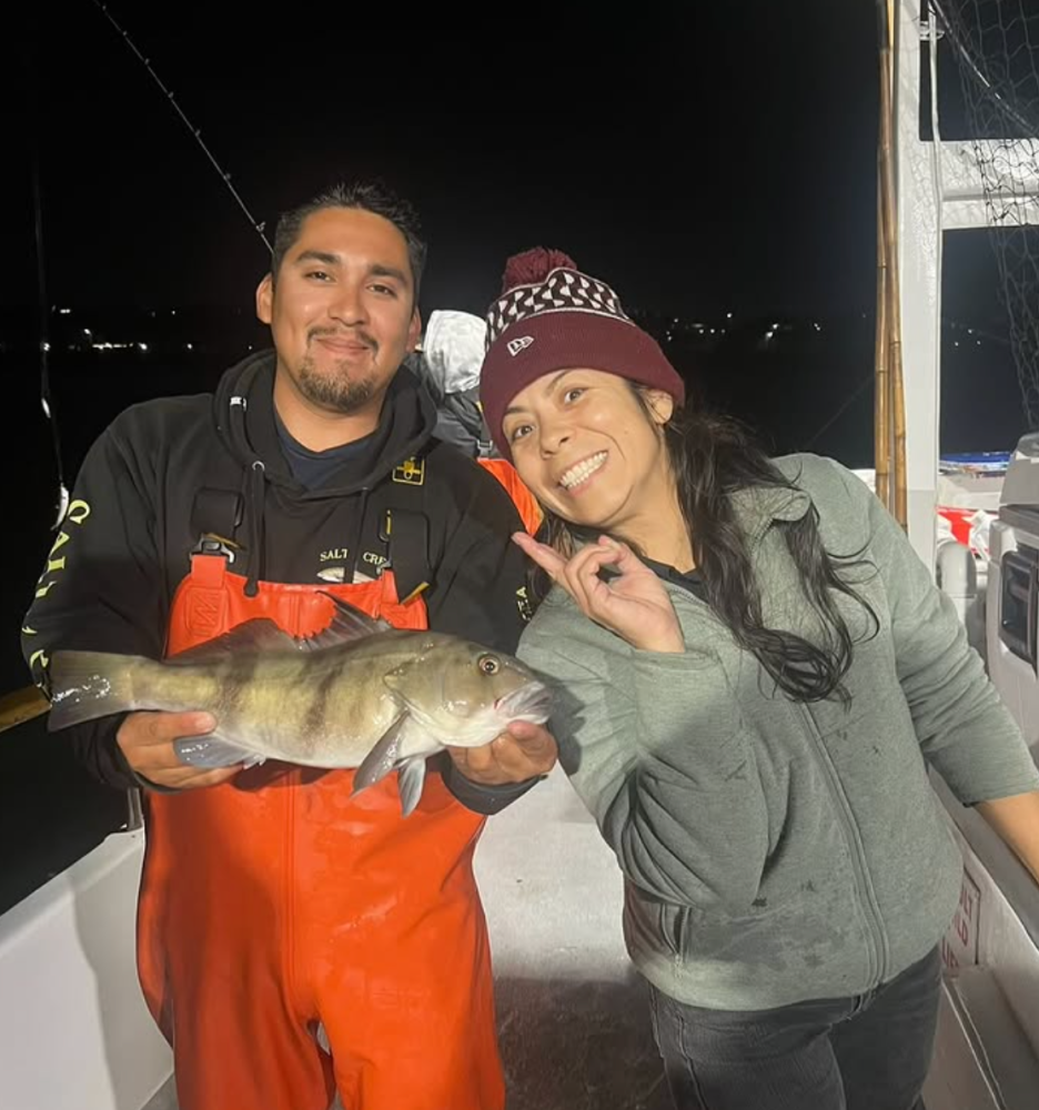 a person holding a fish
