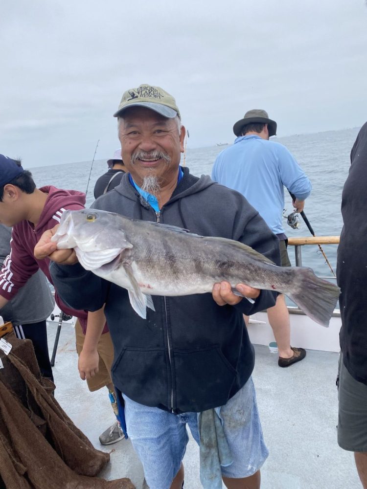 a person holding a fish