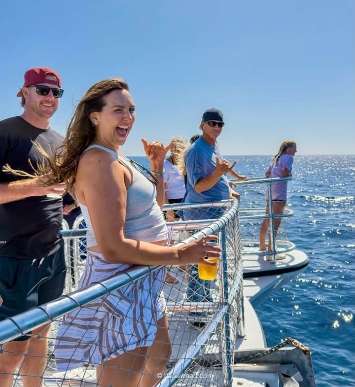 Guests on the deck of a Dana Wharf whale watching boat off Dana Point, an easy day trip from Anaheim and Disneyland