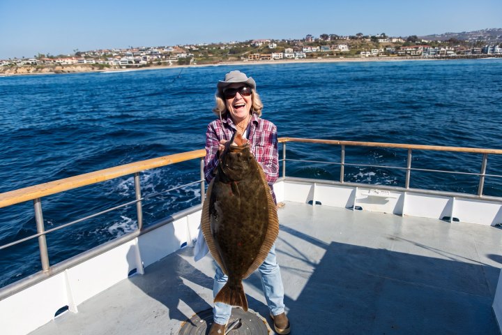 Angler with their catch on the Dana Wharf Halibut Derby out of Dana Point