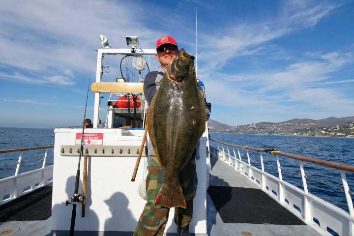 Angler with their catch on the Dana Wharf Halibut Derby out of Dana Point