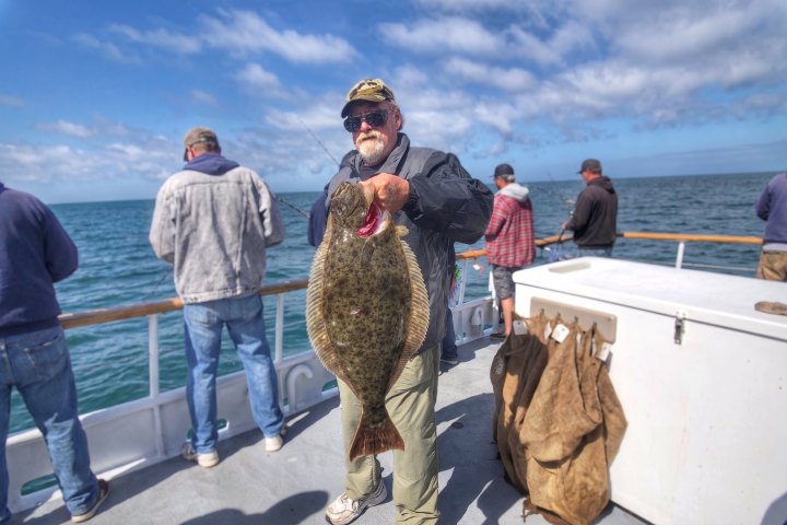 Angler with their catch on the Dana Wharf Halibut Derby out of Dana Point